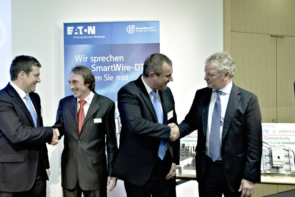 New Eaton SmartWire-DT business partners: Hilscher and Wöhner sign cooperation agreement at SPS/IPC/DRIVES 2011.